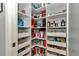 Walk-in pantry with custom shelving for ample storage and organization at 5560 Ne 31St Ter, Ocala, FL 34479