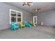 Screened patio with seating and ceiling fans at 5560 Ne 31St Ter, Ocala, FL 34479