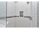Close-up of the tiled shower with niche and glass door at 5560 Ne 31St Ter, Ocala, FL 34479
