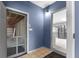 The entryway leads to the kitchen and garage featuring tile flooring and a neutral color palette at 5615 Se 113Th Pl, Belleview, FL 34420