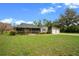 Charming single-story home with a screened porch and attached two-car garage at 5615 Se 113Th Pl, Belleview, FL 34420