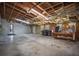 Spacious garage featuring unfinished ceiling, two garage doors, and lots of potential at 5615 Se 113Th Pl, Belleview, FL 34420