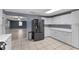Bright kitchen with stainless steel appliances, white cabinets, and an open floor plan at 5615 Se 113Th Pl, Belleview, FL 34420