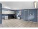 Large laundry room features tile floors, white cabinetry, window, washer, dryer and sink at 5615 Se 113Th Pl, Belleview, FL 34420