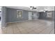 Spacious living room featuring tile flooring, neutral paint, and bright windows at 5615 Se 113Th Pl, Belleview, FL 34420