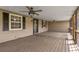 Screened porch with ceiling fans, providing a relaxing outdoor space at 5615 Se 113Th Pl, Belleview, FL 34420