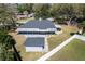 Elevated perspective of a home displaying the spacious lot, screened-in patio, and fenced yard at 5620 Se 9Th St, Ocala, FL 34480