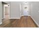 Modern entryway features wood-look floors, neutral paint, and a view into the expansive living room at 5620 Se 9Th St, Ocala, FL 34480