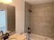 Bathroom showcasing tiled shower with updated fixtures, vanity with granite countertop and modern mirror at 74 Fisher Terrace, Ocklawaha, FL 32179