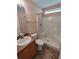 Bathroom featuring vanity with solid surface counter and a shower and tub combo at 7407 Sw 112Th Pl, Ocala, FL 34476