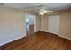 View of the bedroom with hardwood floors with a closet and view to the other rooms at 7407 Sw 112Th Pl, Ocala, FL 34476