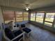 Cozy sunroom with tiled floor and big windows providing abundant natural light at 7407 Sw 112Th Pl, Ocala, FL 34476