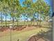 Scenic backyard view overlooking a well-maintained golf course with mature trees at 7527 Sw 97Th Terrace Rd, Ocala, FL 34481