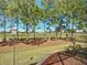 Scenic backyard view overlooking a well-maintained golf course with mature trees at 7527 Sw 97Th Terrace Rd, Ocala, FL 34481