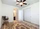 Bedroom featuring a chair, patterned rug, ensuite bathroom and closet space at 7527 Sw 97Th Terrace Rd, Ocala, FL 34481