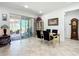 Elegant dining room with sliding glass doors to the patio and a table that seats four at 7527 Sw 97Th Terrace Rd, Ocala, FL 34481