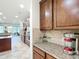 Kitchen view showing stainless steel appliances, granite countertops, tile backsplash and a breakfast nook at 7527 Sw 97Th Terrace Rd, Ocala, FL 34481