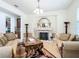 Comfortable living room with a marble fireplace, elegant decor, and open layout at 7527 Sw 97Th Terrace Rd, Ocala, FL 34481