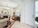 Inviting living room featuring a fireplace, tile floors, and elegant furnishings at 7527 Sw 97Th Terrace Rd, Ocala, FL 34481