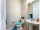 Clean powder room featuring a pedestal sink, and toilet at 7527 Sw 97Th Terrace Rd, Ocala, FL 34481