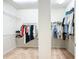 Spacious walk-in closet with ample hanging space and built-in shelving at 7527 Sw 97Th Terrace Rd, Ocala, FL 34481