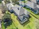 Aerial view of the home showcasing the screened lanai and tile roof at 8033 Nw 28Th St, Ocala, FL 34482