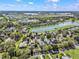 Aerial view of the community featuring a lake and the World Equestrian Center in the distance at 8033 Nw 28Th St, Ocala, FL 34482