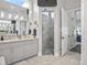 Bathroom with double vanity, tiled shower, and modern design elements at 8033 Nw 28Th St, Ocala, FL 34482