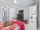 Bedroom featuring a ceiling fan, and connecting hall at 8033 Nw 28Th St, Ocala, FL 34482