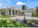 Charming single-story home showcasing the beautifully patterned driveway and manicured front lawn at 8033 Nw 28Th St, Ocala, FL 34482