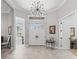 Spacious foyer with tiled floor, high ceiling, and natural light coming from the front doors at 8033 Nw 28Th St, Ocala, FL 34482