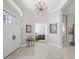 Bright foyer with tiled floor, modern light fixture, and views into other rooms at 8033 Nw 28Th St, Ocala, FL 34482