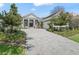 Charming single-story home features manicured landscaping, a paved driveway, and a welcoming entrance at 8033 Nw 28Th St, Ocala, FL 34482
