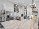 Bright, modern kitchen with stainless steel appliances, marble countertops, and white cabinets at 8033 Nw 28Th St, Ocala, FL 34482