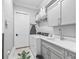 Laundry room with washer, dryer, sink, and alligator rug at 8033 Nw 28Th St, Ocala, FL 34482