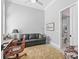 Cozy office space with a comfortable leather couch, area rug, and natural light at 8033 Nw 28Th St, Ocala, FL 34482