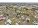 Wide aerial view of a residential neighborhood, highlighting community layout and green spaces at 8106 County Road 109, Lady Lake, FL 32159