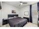 Comfortable bedroom with a modern dark headboard, ceiling fan, and a serene atmosphere at 8802 Sw 79Th Loop, Ocala, FL 34481