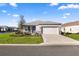Charming single-story home with well-manicured lawn and a two-car garage on a sunny day at 8802 Sw 79Th Loop, Ocala, FL 34481