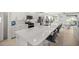 Bright, open kitchen featuring a large island with seating and stainless steel appliances at 8802 Sw 79Th Loop, Ocala, FL 34481