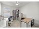 Cozy home office with ample shelving, a large desk, and comfortable seating, perfect for productivity at 8802 Sw 79Th Loop, Ocala, FL 34481