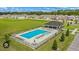 Aerial view of community pool surrounded by green space and homes in a Gathering-friendly neighborhood at 8899 Sw 50Th Ave, Ocala, FL 34476