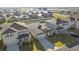 Beautiful aerial view of well-manicured lawns on several homes with easy-to-access driveway and garage at 8899 Sw 50Th Ave, Ocala, FL 34476