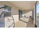 Enclosed back porch featuring a modern hanging chair and room to relax, sit, or work at 8899 Sw 50Th Ave, Ocala, FL 34476