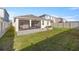 This home features a lawn and patio with a comfortable screened-in porch with a view of the yard at 8899 Sw 50Th Ave, Ocala, FL 34476