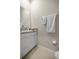Half bathroom featuring granite counter, white cabinet and tile flooring at 8899 Sw 50Th Ave, Ocala, FL 34476