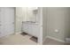 Bathroom featuring double sink vanity, granite countertop, and tile floor at 8899 Sw 50Th Ave, Ocala, FL 34476