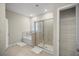 Bathroom with a soaking tub, glass-enclosed shower, and separate closet, offering a luxurious and private space at 8899 Sw 50Th Ave, Ocala, FL 34476
