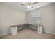 Bedroom with a ceiling fan, a window and a long built-in desk at 8899 Sw 50Th Ave, Ocala, FL 34476
