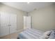 This bedroom offers neutral paint, carpeted floor, closet, and white door to ensure comfort and privacy at 8899 Sw 50Th Ave, Ocala, FL 34476